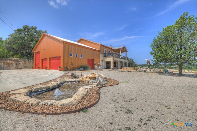 exterior space with a garage and an outdoor structure