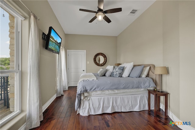 bedroom featuring ceiling fan and dark hardwood / wood-style floors