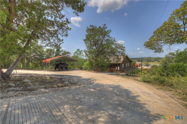 exterior space featuring a carport