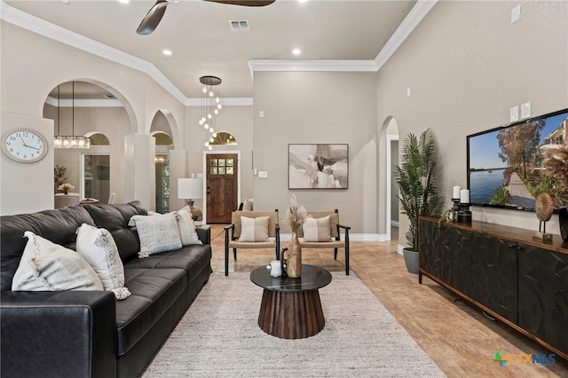 155 Woodrow Center Rd, Kingsbury, TX 78638 - living room featuring crown molding, arched walkways, ceiling fan, recessed lighting, and a high ceiling