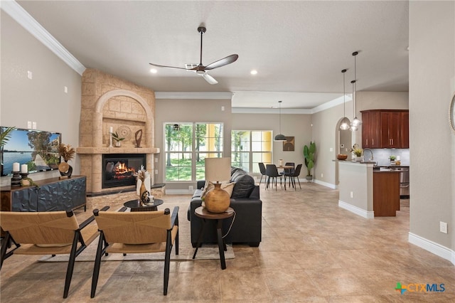 155 Woodrow Center Rd, Kingsbury, TX 78638 - living room featuring ornamental molding, ceiling fan, a large fireplace, recessed lighting, and light tile patterned floors