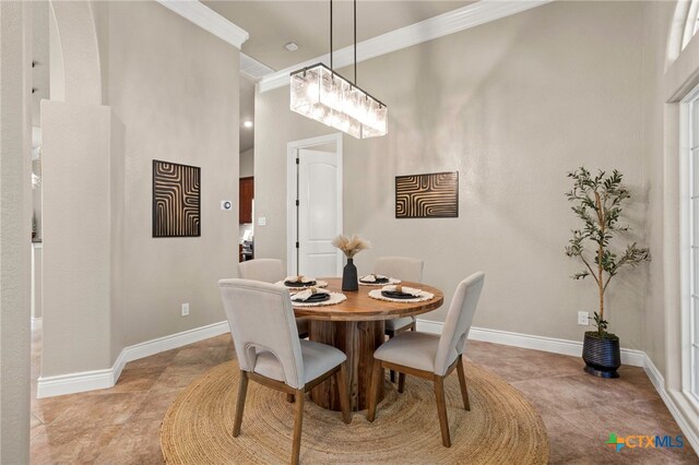 155 Woodrow Center Rd, Kingsbury, TX 78638 - dining space with crown molding, a chandelier, and light tile patterned floors