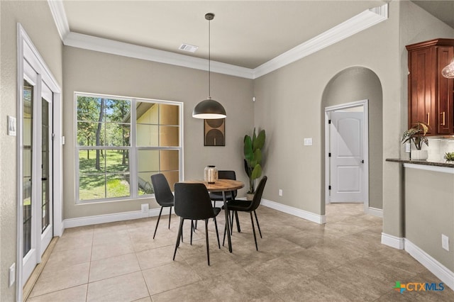155 Woodrow Center Rd, Kingsbury, TX 78638 - dining room with ornamental molding, arched walkways, healthy amount of natural light, and light tile patterned flooring
