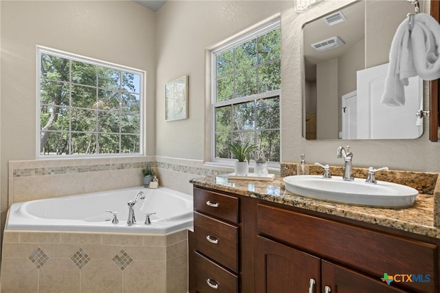 155 Woodrow Center Rd, Kingsbury, TX 78638 - bathroom with vanity and a garden tub