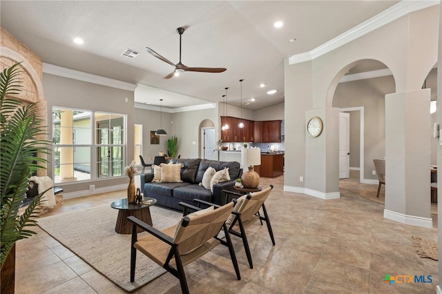 155 Woodrow Center Rd, Kingsbury, TX 78638 - living area featuring ceiling fan, arched walkways, ornamental molding, recessed lighting, and light tile patterned flooring
