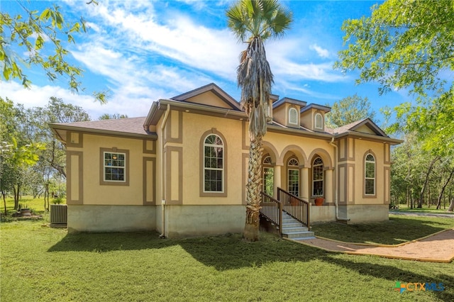 155 Woodrow Center Rd, Kingsbury, TX 78638 - mediterranean / spanish home with a front lawn and stucco siding