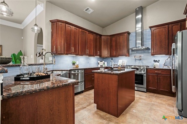 155 Woodrow Center Rd, Kingsbury, TX 78638 - kitchen with wall chimney exhaust hood, appliances with stainless steel finishes, dark stone countertops, backsplash, and crown molding