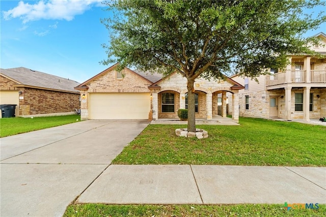 view of front of house with concrete driveway, stone siding, a front lawn, and a garage