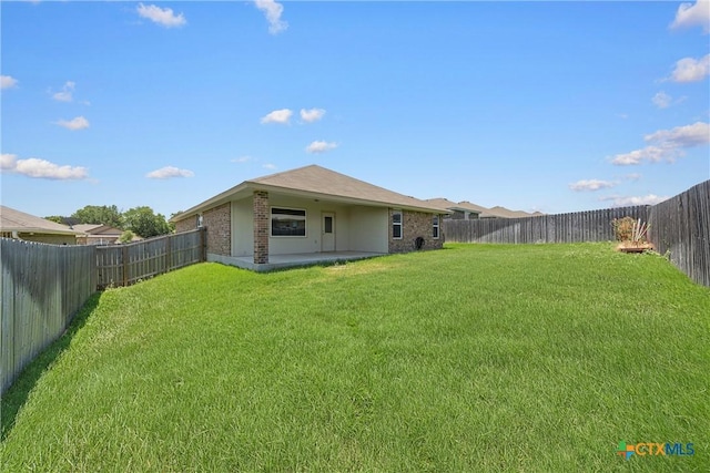 back of house featuring a patio and brick siding