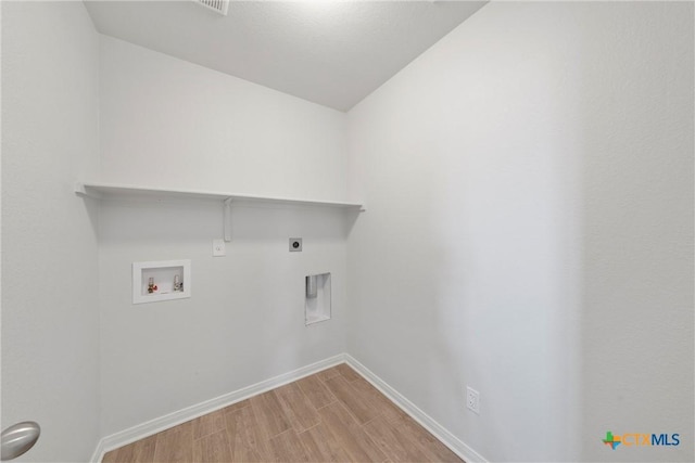 laundry area with washer hookup, light wood-style flooring, baseboards, and hookup for an electric dryer