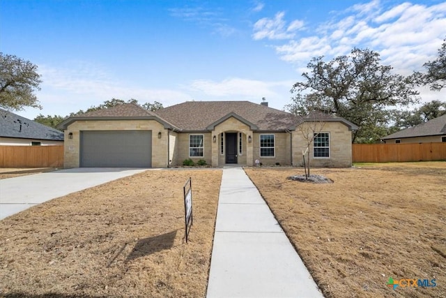 ranch-style home with a garage