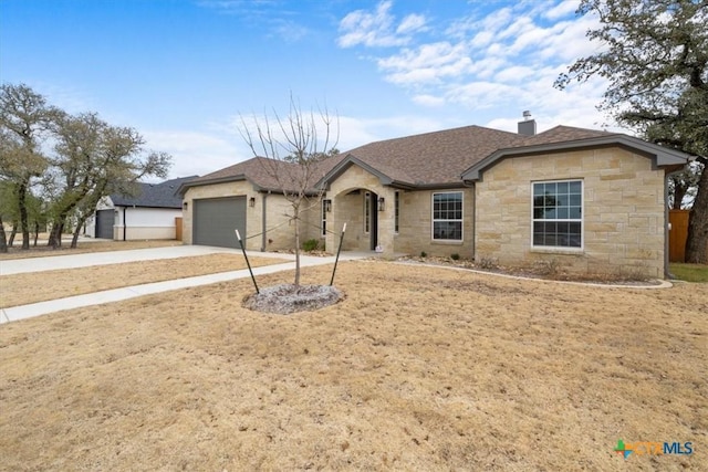 ranch-style home featuring a garage