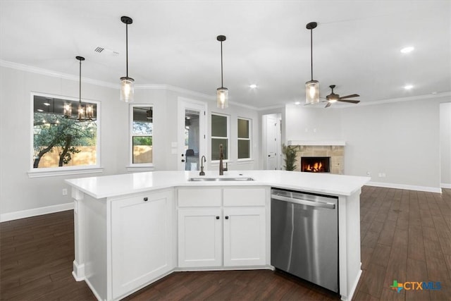 kitchen with sink, dark hardwood / wood-style floors, stainless steel dishwasher, white cabinets, and an island with sink