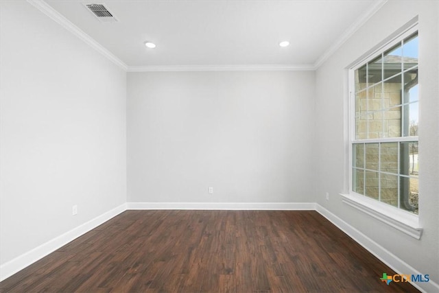 spare room with crown molding and dark hardwood / wood-style floors