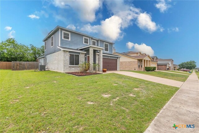 5304 Oster Dr, Killeen, TX 76542 - view of front facade featuring concrete driveway, brick siding, and an attached garage