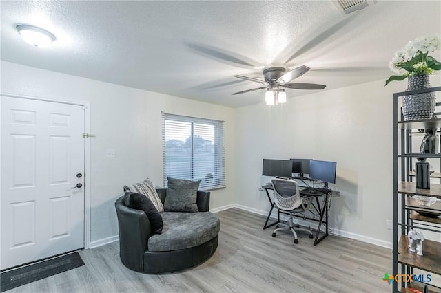 5304 Oster Dr, Killeen, TX 76542 - office area featuring wood finished floors, a textured ceiling, a ceiling fan, and baseboards
