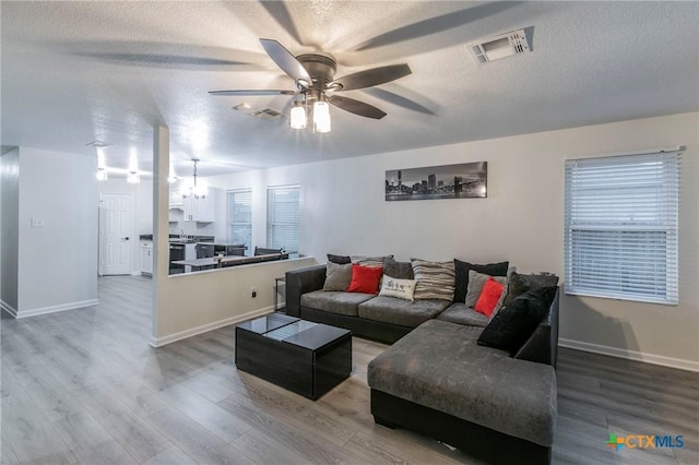 5304 Oster Dr, Killeen, TX 76542 - living room with ceiling fan, a textured ceiling, wood finished floors, and baseboards