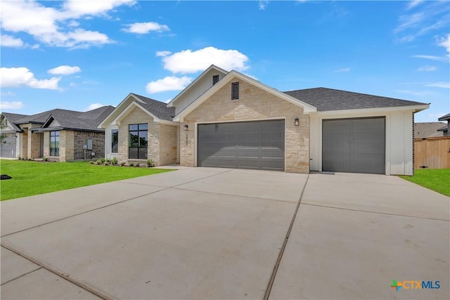 view of front of house featuring a garage and a front yard