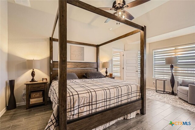 3256 Pablo Cir, Round Rock, TX 78665 - bedroom featuring lofted ceiling, wood finished floors, baseboards, and a ceiling fan