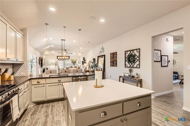 3256 Pablo Cir, Round Rock, TX 78665 - kitchen featuring a sink, stainless steel appliances, a peninsula, a center island, and recessed lighting