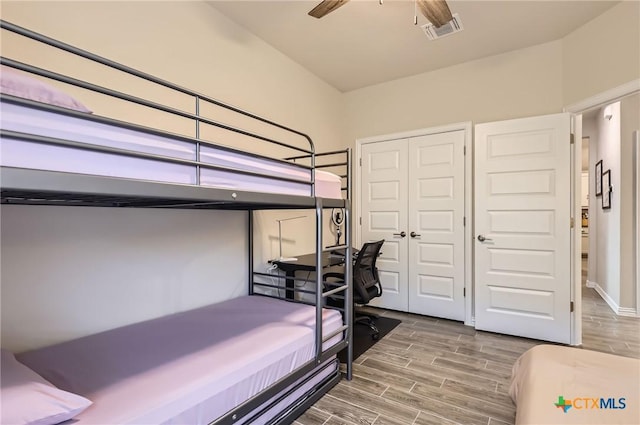 3256 Pablo Cir, Round Rock, TX 78665 - bedroom with wood finished floors, a closet, and ceiling fan