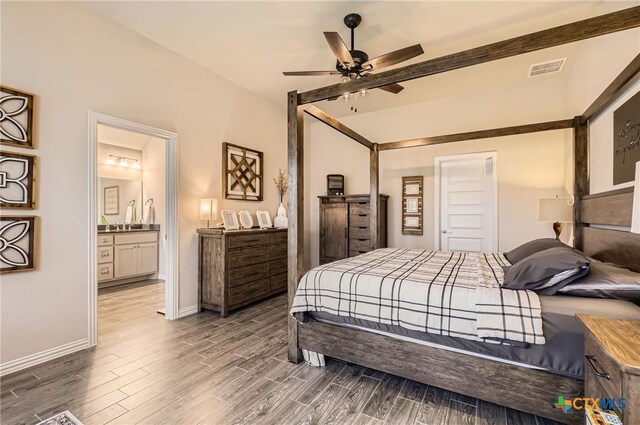 3256 Pablo Cir, Round Rock, TX 78665 - bedroom with wood finished floors, baseboards, connected bathroom, and a ceiling fan