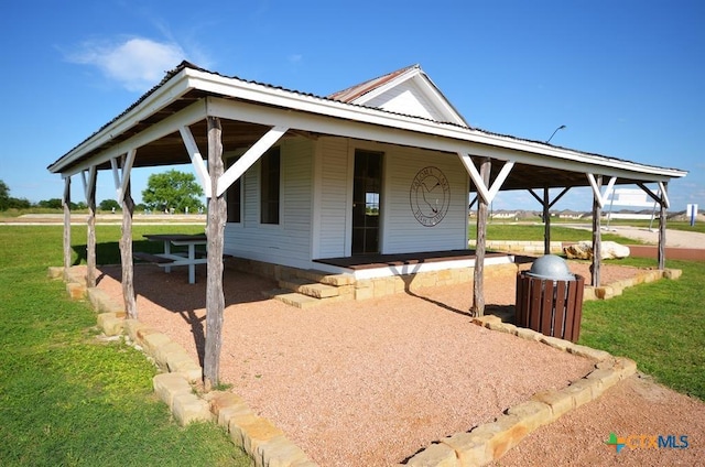 3256 Pablo Cir, Round Rock, TX 78665 - view of front of house featuring metal roof, a front yard, and a porch