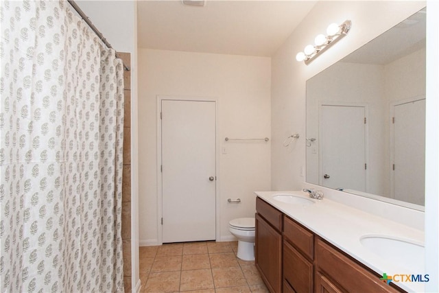 1217 Roanoke Dr, Temple, TX 76504 - full bath with double vanity, tile patterned floors, and a shower with shower curtain