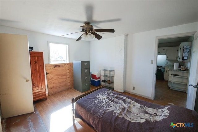 bedroom with ceiling fan and dark hardwood / wood-style floors