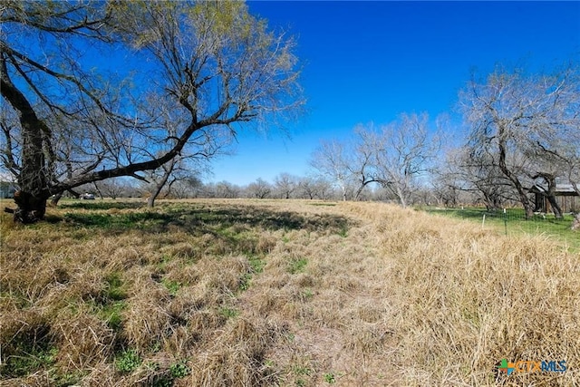 view of landscape with a rural view