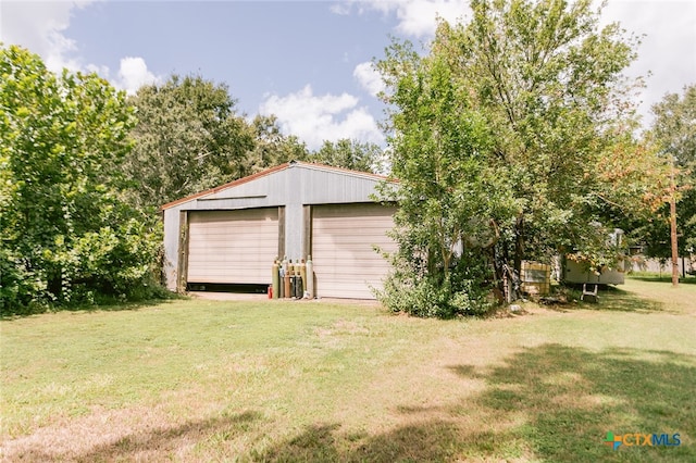 garage with a lawn