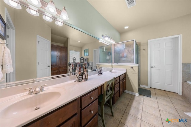 8717 Surrey Ct, Temple, TX 76502 - full bath with tile patterned flooring, double vanity, a shower stall, and a bath