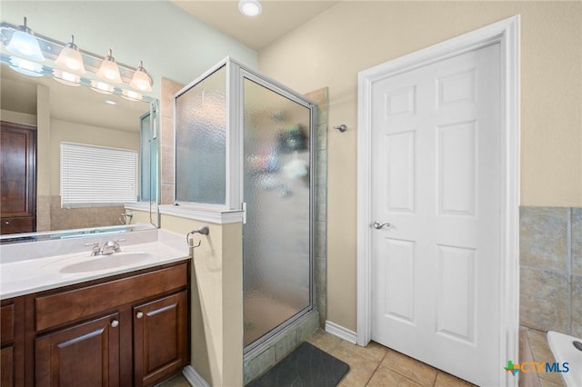 8717 Surrey Ct, Temple, TX 76502 - full bath with tile patterned flooring, a shower stall, vanity, and a bath