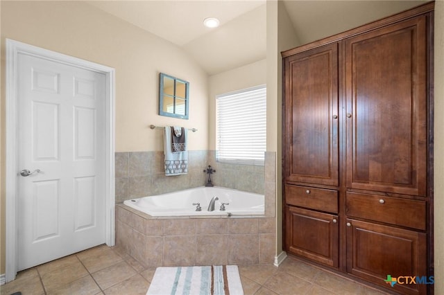 8717 Surrey Ct, Temple, TX 76502 - bathroom with tile patterned flooring, a garden tub, and lofted ceiling