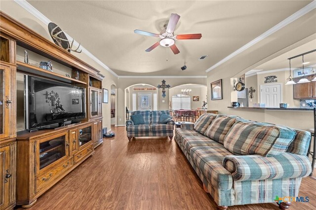 8717 Surrey Ct, Temple, TX 76502 - living room featuring arched walkways, crown molding, wood finished floors, and ceiling fan