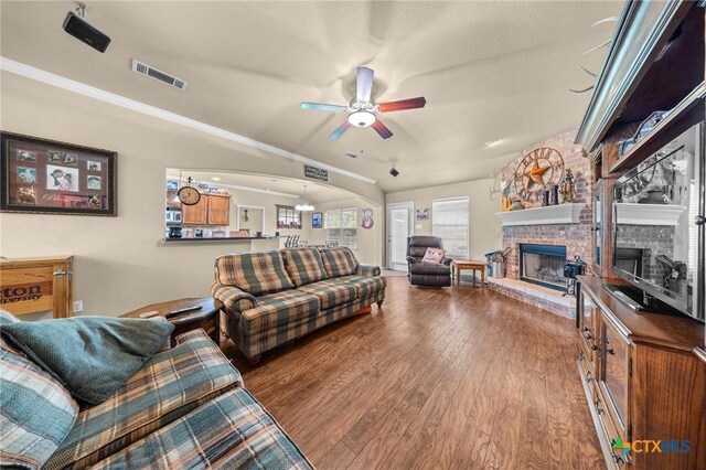 8717 Surrey Ct, Temple, TX 76502 - living area with a fireplace, a ceiling fan, and wood finished floors