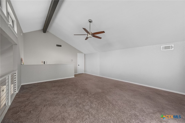 additional living space featuring lofted ceiling with beams, dark colored carpet, and ceiling fan