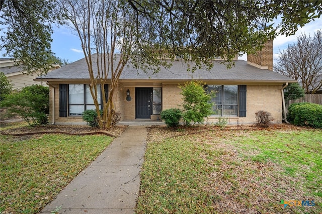 ranch-style house with a front lawn