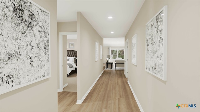 corridor featuring light hardwood / wood-style floors