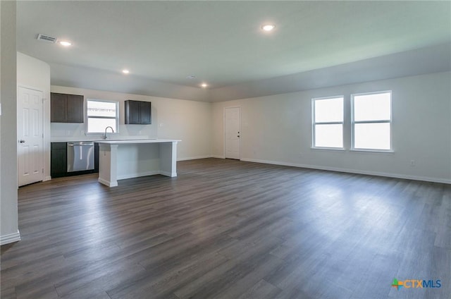 unfurnished living room featuring dark hardwood / wood-style flooring