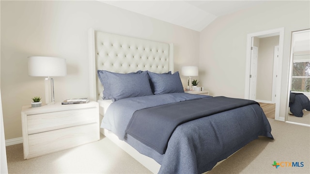 bedroom featuring lofted ceiling and carpet floors