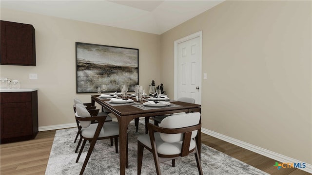 dining space featuring light wood-type flooring