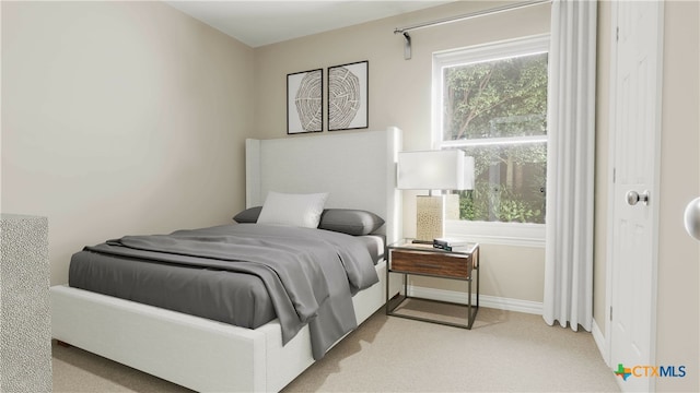 bedroom featuring light colored carpet