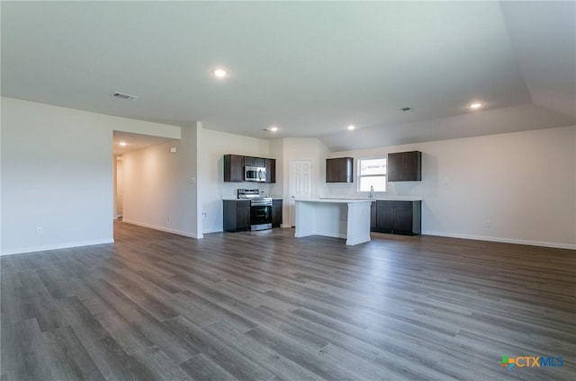 unfurnished living room featuring dark hardwood / wood-style flooring and sink