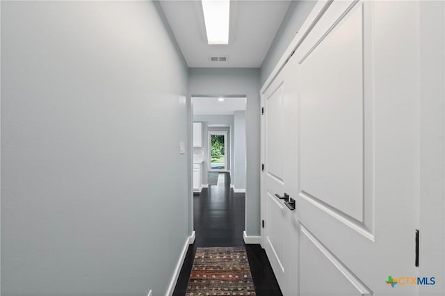 1600 N Beal St, Belton, TX 76513 - hall with dark wood-type flooring and baseboards