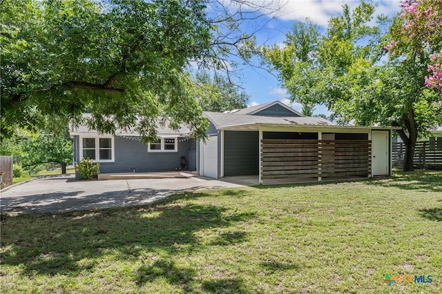 1600 N Beal St, Belton, TX 76513 - back of house featuring an attached carport and driveway