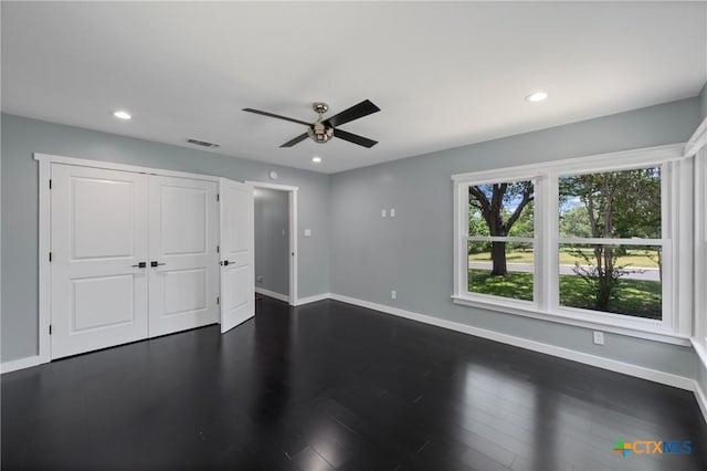 1600 N Beal St, Belton, TX 76513 - unfurnished bedroom with dark wood-style flooring, recessed lighting, a ceiling fan, and a closet