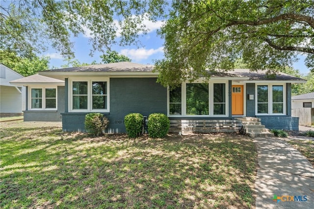 1600 N Beal St, Belton, TX 76513 - view of front of property with a front yard and brick siding