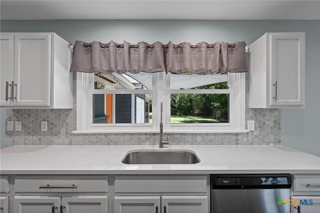 1600 N Beal St, Belton, TX 76513 - kitchen featuring dishwasher, light countertops, and decorative backsplash