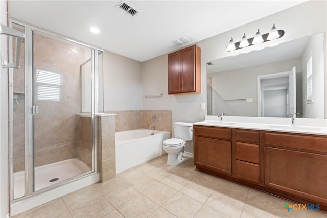 3907 Gentle Mdw, New Braunfels, TX 78130 - full bathroom with double vanity, a garden tub, toilet, a shower stall, and tile patterned floors
